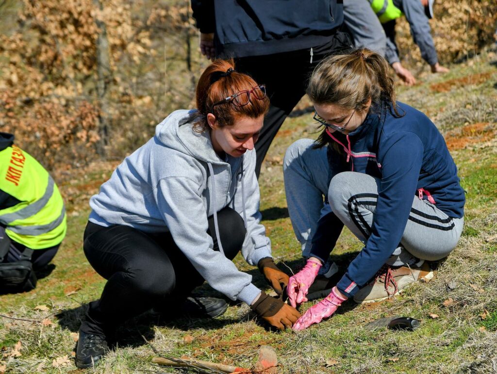 Ana and Marija planting trees